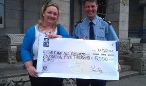 Sergeant Ronan Carey pictured with Jack and Jill Liaison Nurse, Anne Reilly