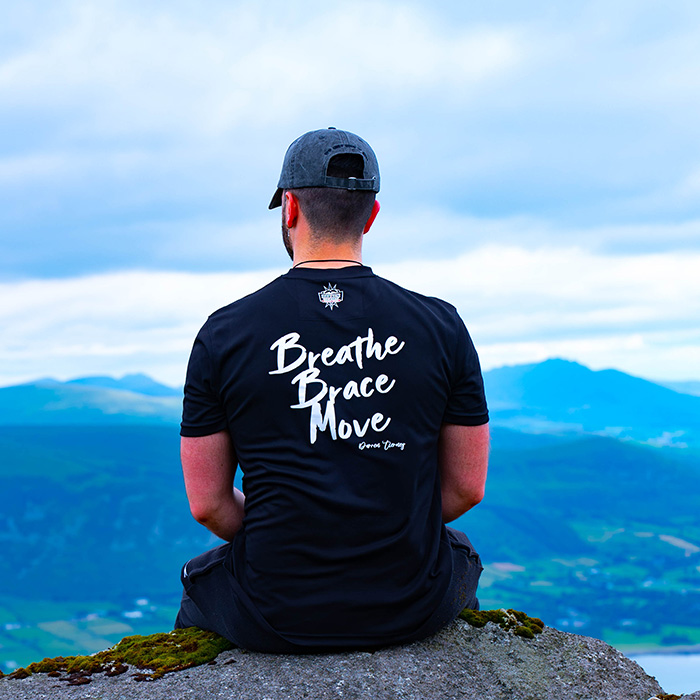 Image of man sitting on mountain