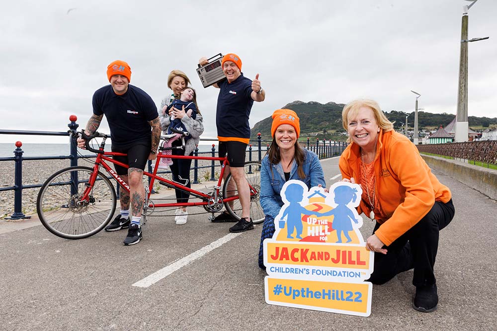 PJ and Jim on tandem bicycle with June, Carmel, Tracey and Willow