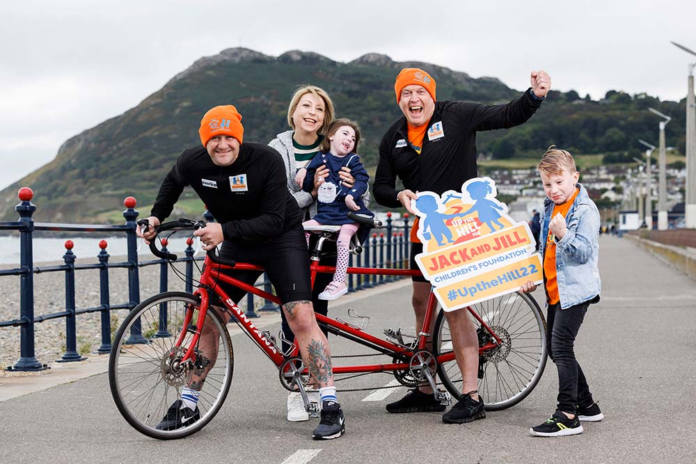 PJ and Jim on tandem bicycle with Noah, Tracey and Willow