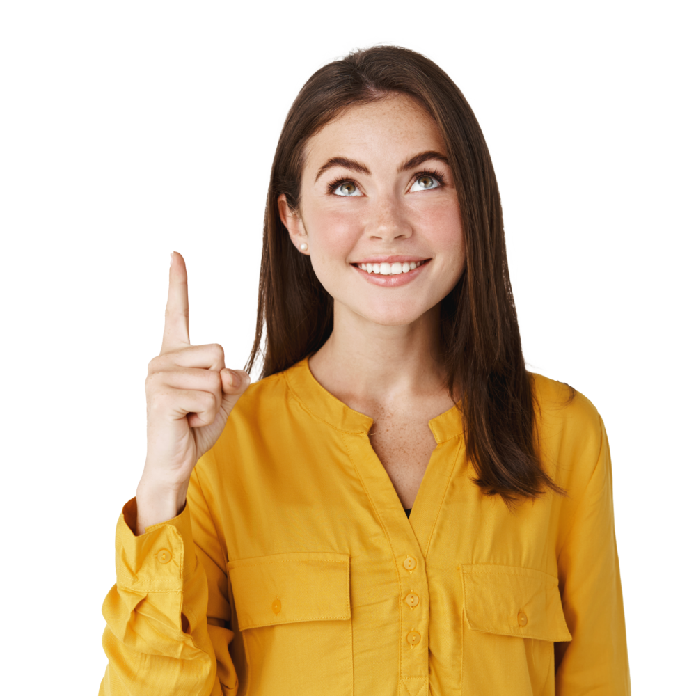 close up young female student smiling looking pointing finger up showing promo offer copy space standing white wall