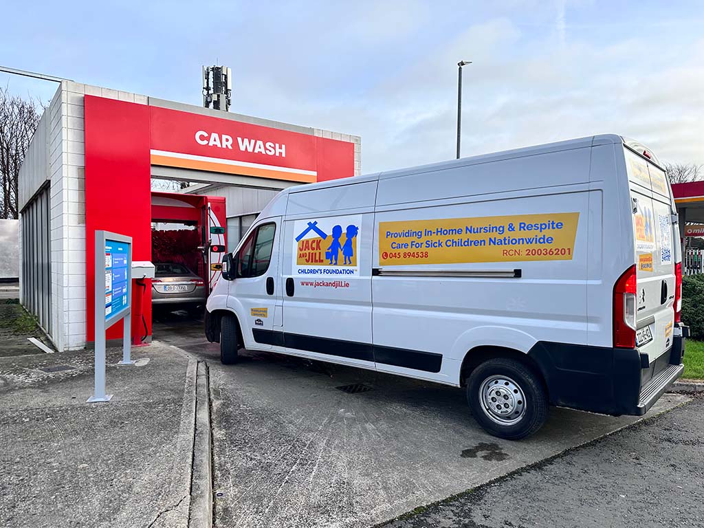 A Jack and Jill Boutiques Van in line for a Circle car wash