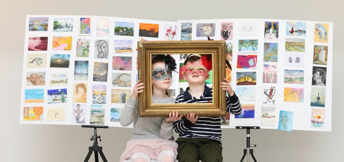 incognito 20243 image of two children holding picture frames