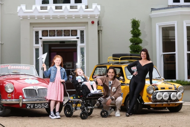 Jack and Jill child and sibling with Jack Carter & Karen Byrne posing with Retro Cannonball cars