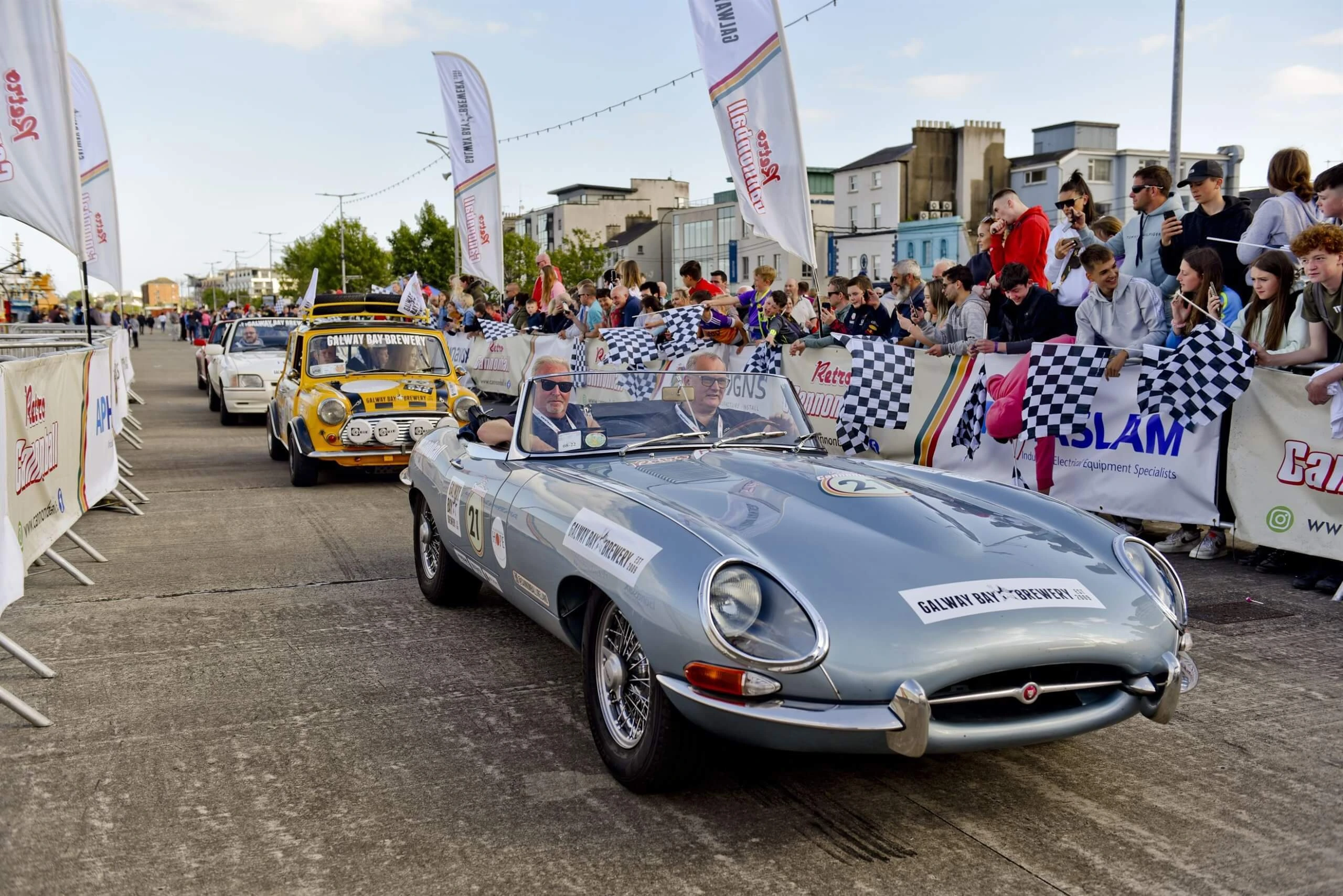 retro cars passing through the route on the retro cannonball
