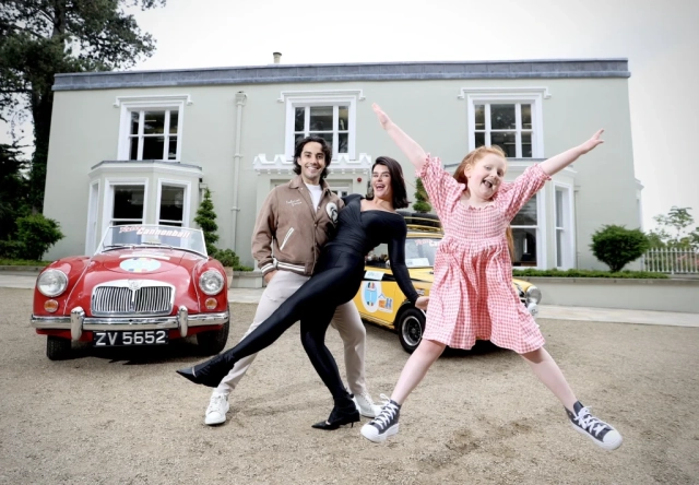 Jack Carter, Karen Byrne and Jack and Jill child's sibling Heidi in front of Retro cars for Retro Cannonball 2025