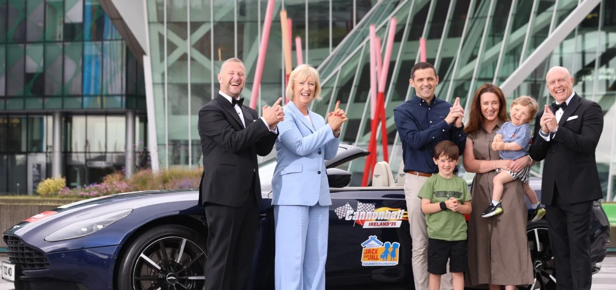 Radio Nova’s PJ Gallagher and Jim McCabe, Deirde Walsh Jack and Jill CEO and the Mangan family standing in front of Aston Martin DB11