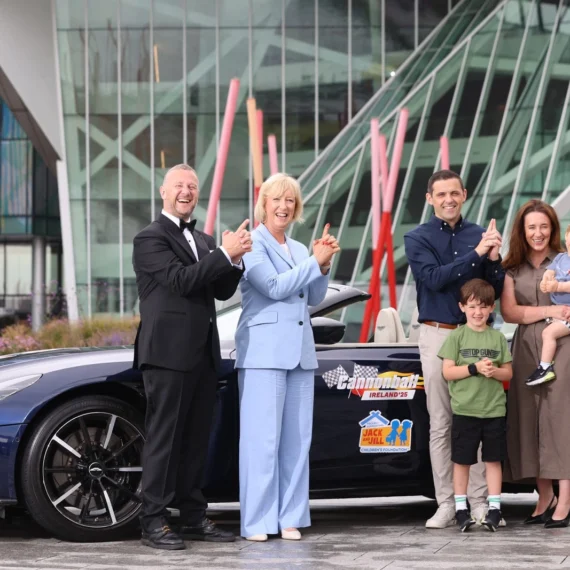 Radio Nova’s PJ Gallagher and Jim McCabe, Deirde Walsh Jack and Jill CEO and the Mangan family standing in front of Aston Martin DB11