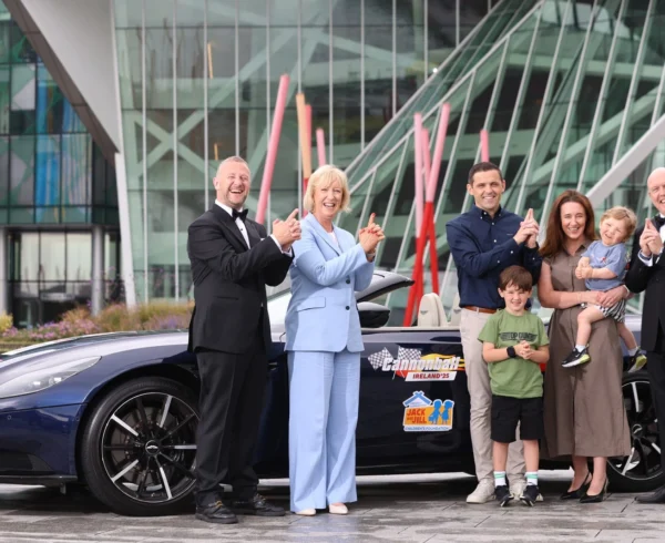 Radio Nova’s PJ Gallagher and Jim McCabe, Deirde Walsh Jack and Jill CEO and the Mangan family standing in front of Aston Martin DB11