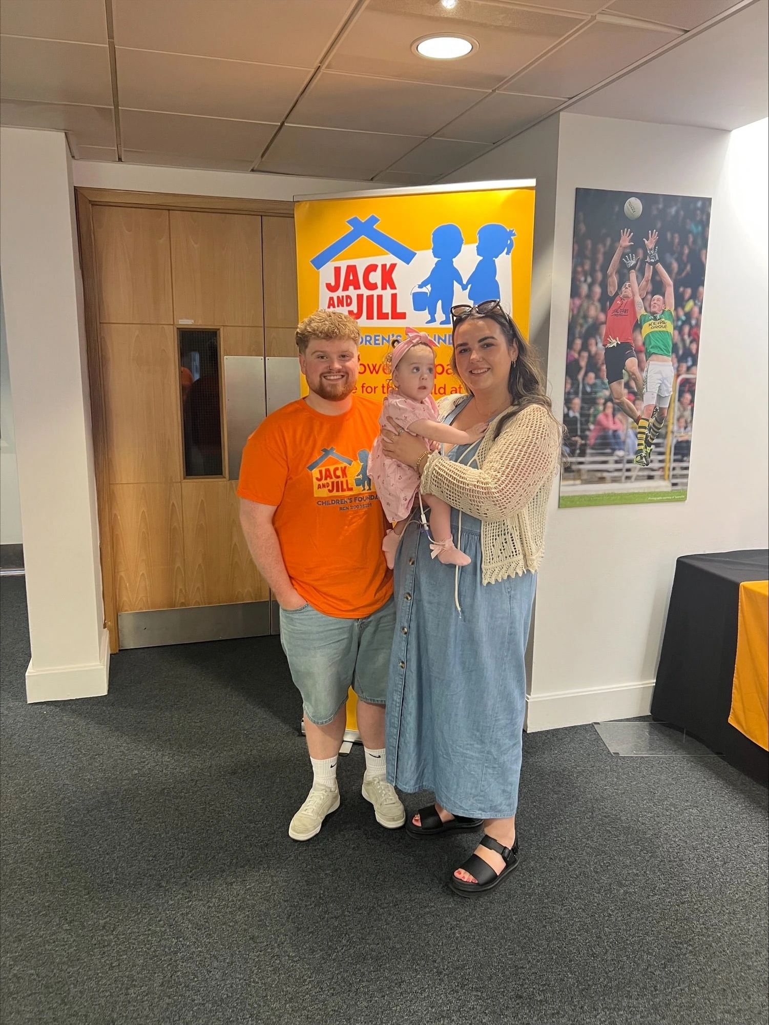 Jack and Jill Abseil participant with partner and child 2025
