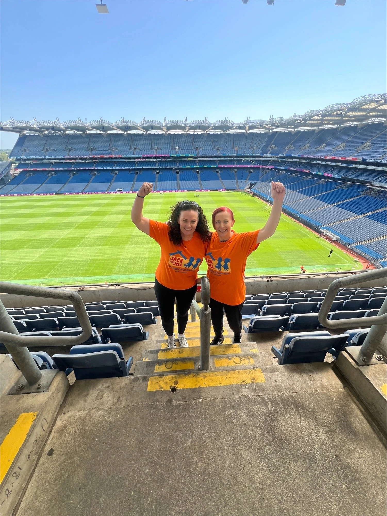 Jack and Jill Abseil participants 2025 with view of Croke Park pitch behind them