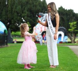 Rose of Tralee Katelyn Cummins giving roses to children at Jack and Jill Family Fun Day