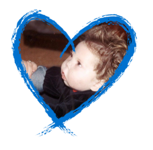 Young Jack Irwin framed inside a blue brushstroke heart