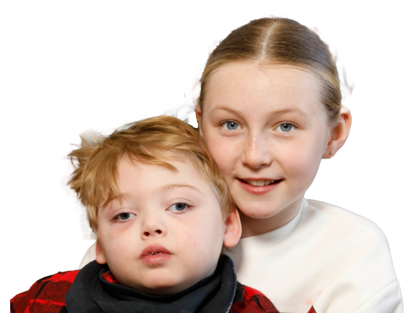 Alfred and his big sister smiling together for Jack and Jill Sibling Support