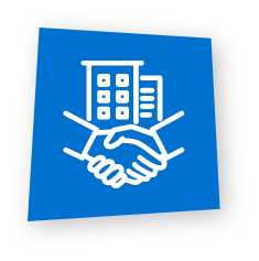 White icon of a handshake in front of office buildings on a blue background