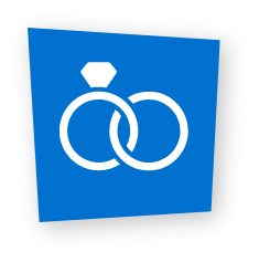 White icon of interlocked wedding rings with a diamond on a blue background