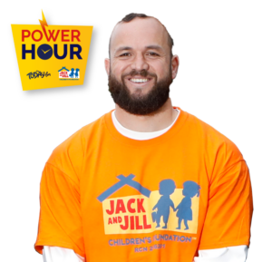 Rugby player Jamison Gibson-Park smiling while wearing an orange Jack and Jill Children's Foundation t-shirt, alongside the Power Hour campaign logo.