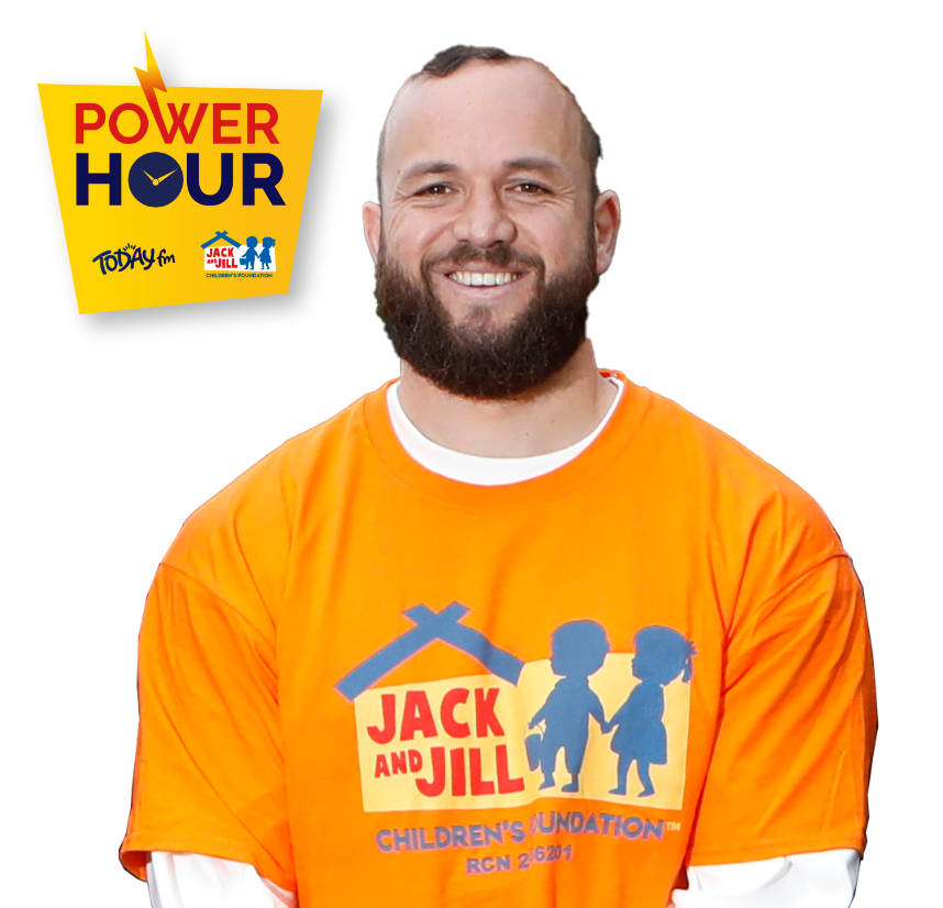 Rugby player Jamison Gibson-Park smiling while wearing an orange Jack and Jill Children's Foundation t-shirt, alongside the Power Hour campaign logo.
