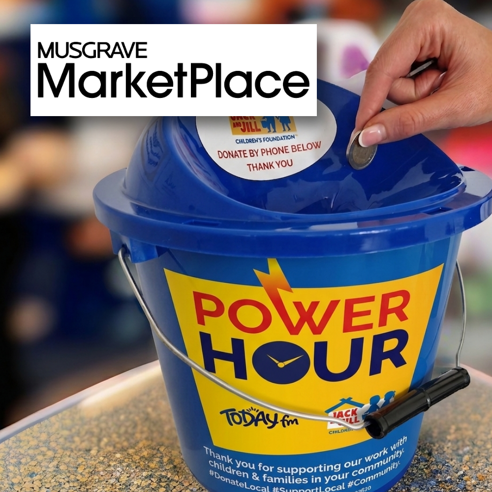 Musgrave Marketplace- Ballymun Bucket Collection A hand dropping a coin into a blue collection bucket featuring a "Power Hour" logo, Today FM, and Jack & Jill Children's Foundation branding, with a Musgrave MarketPlace logo overlaid in the upper-left corner.