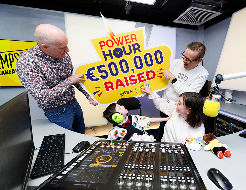Ian Dempsey and the Garrahan Family Ian Dempsey and the Garrahan family celebrating €500,000 raised for the Jack and Jill Foundation in a studio.